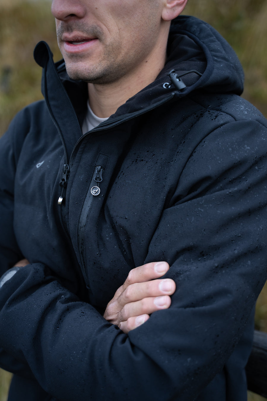 Man wearing a black jacket with a blurred background