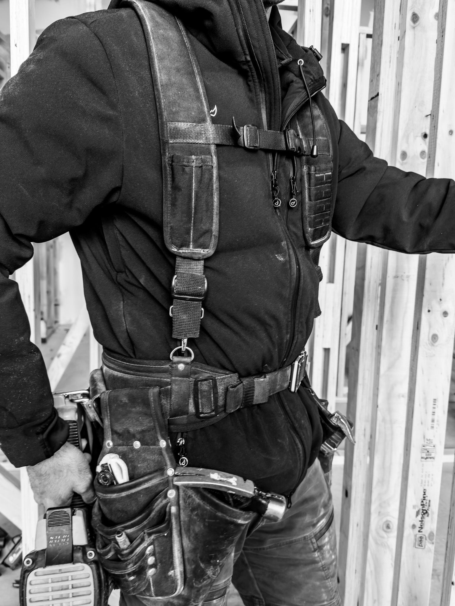 Person wearing a tool belt and  Rhino Skin® jackets.

